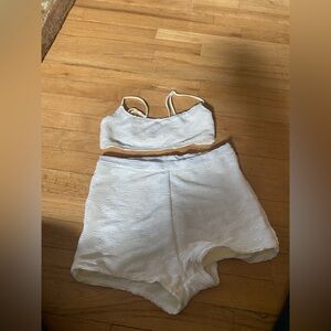 Triangl white bikini top and swim  shorts bottom.
